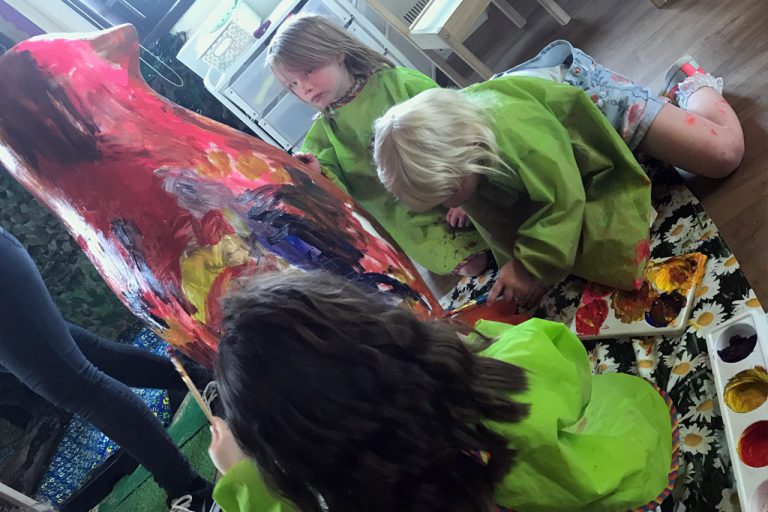 FCSS children painting Slinky