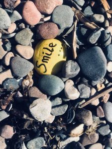 FCSS - rock with 'smile' written on it