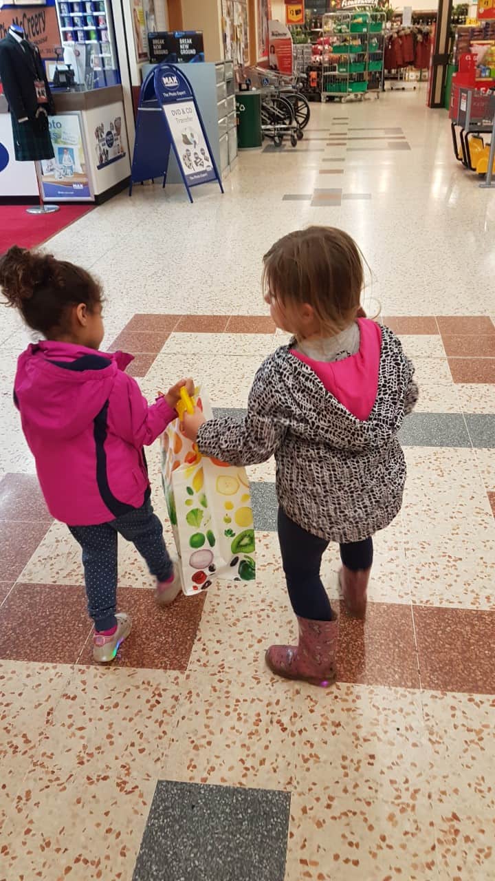 FCSS - young girls in a shopping centre with a bag for life