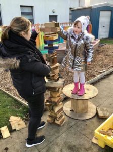 FCSS - child playing outside with FCSS team member