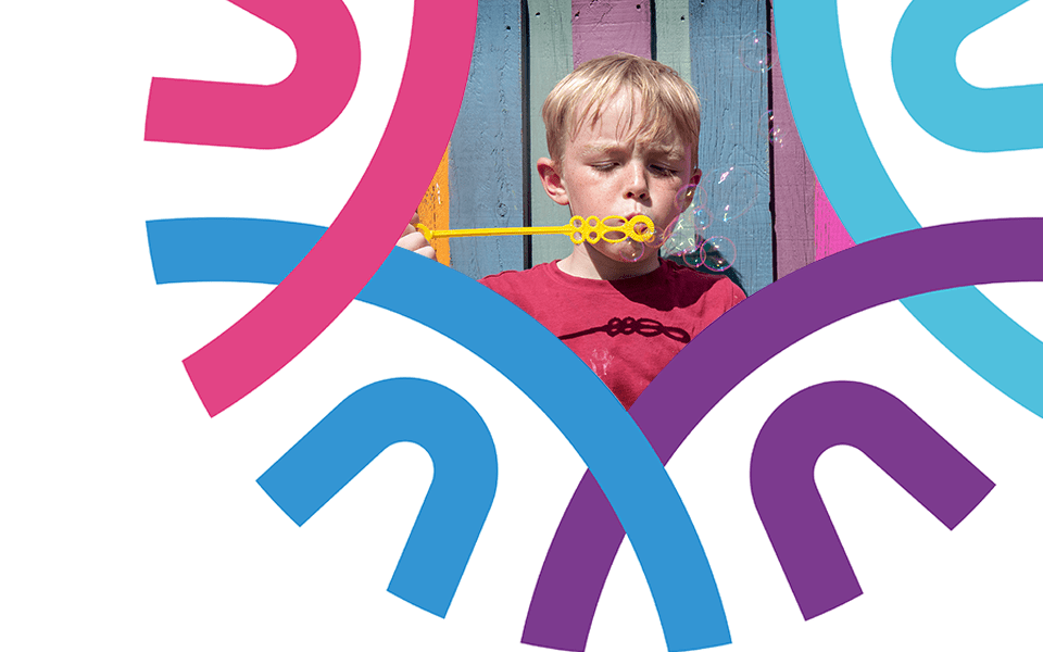 FCSS Settings page header image (child blowing bubbles in abstract frame)