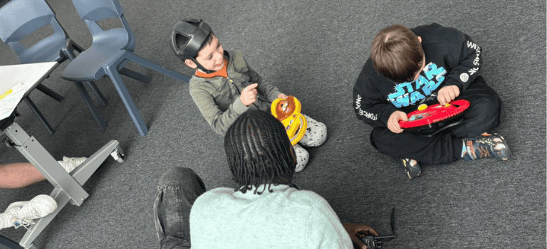 FCSS ASN Groups - children playing with a team member
