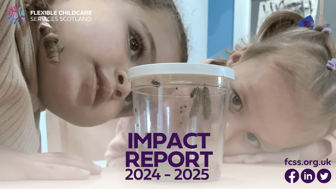 Two girls looking at a caterpillar