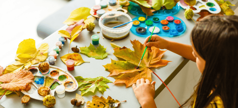 FCSS Girl painting leaves