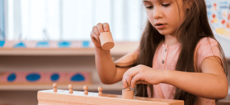 FCSS Case Study. Girl playing with wooden toy