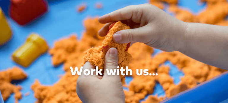 FCSS Job - picture child's hand in sand