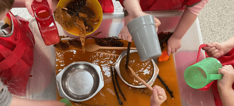 FCSS Case Study - children playing in water tray
