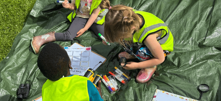 FCSS Children learning literacy outside